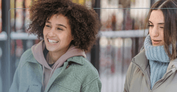 woman with a friend making jokes at her own expense