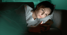woman having difficulty falling asleep