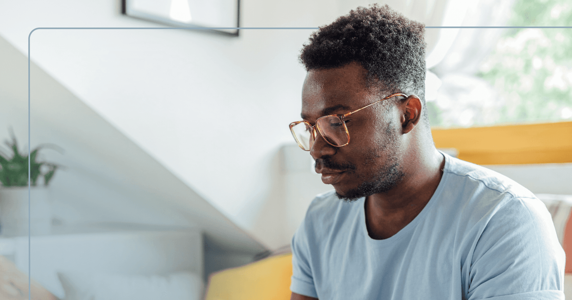 a man in glasses looking off camera with a serious look on his face, representing adhd negative thoughts