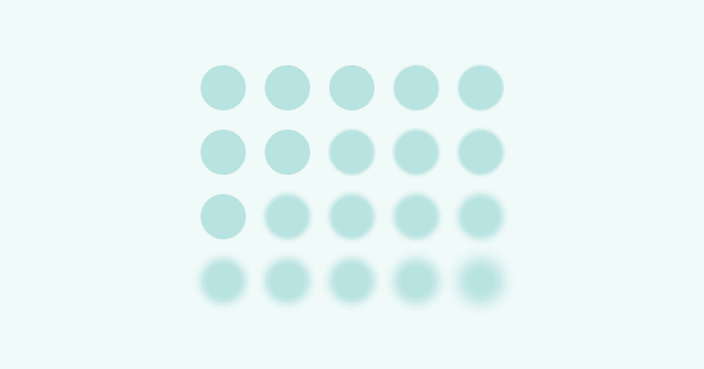 Image shows small blue circles. The circles are all the same size in rows. On the left side of the screen, the circles are in sharp focus. On the right side, the circles are blurry.