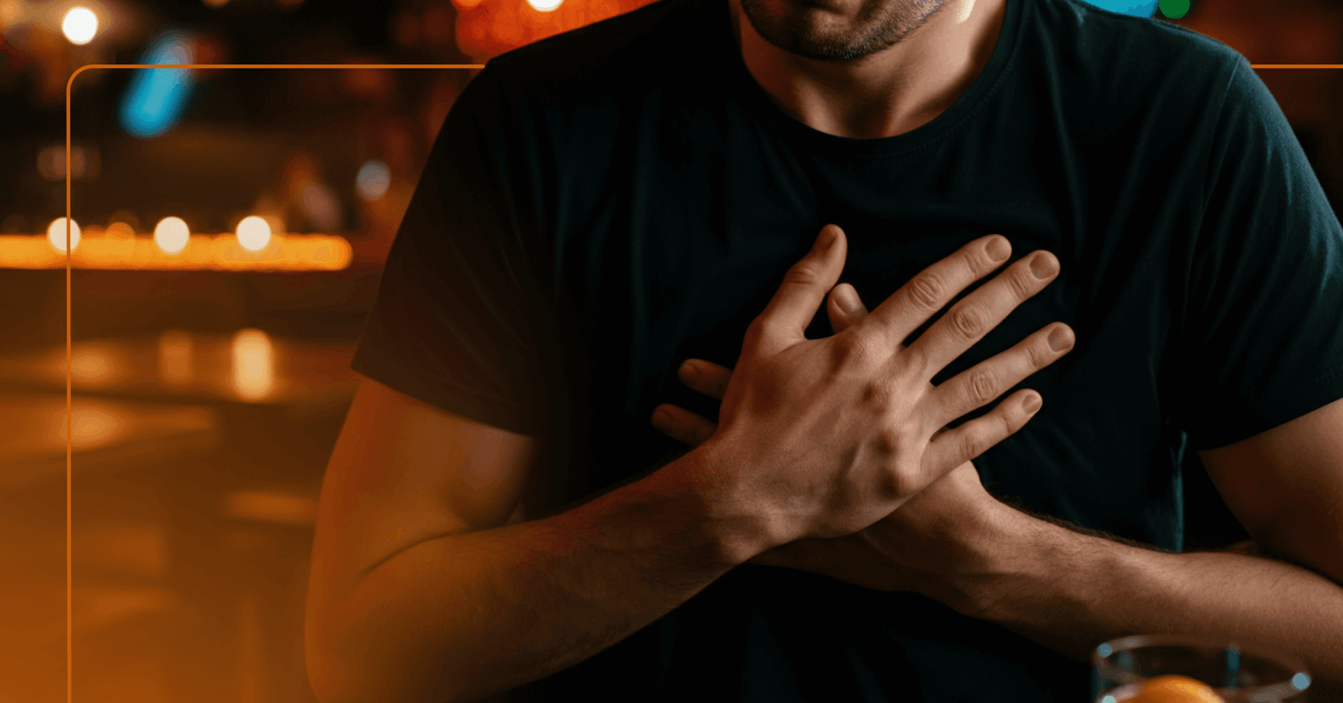 man having a drink with a racing heartbeat that feels out of control