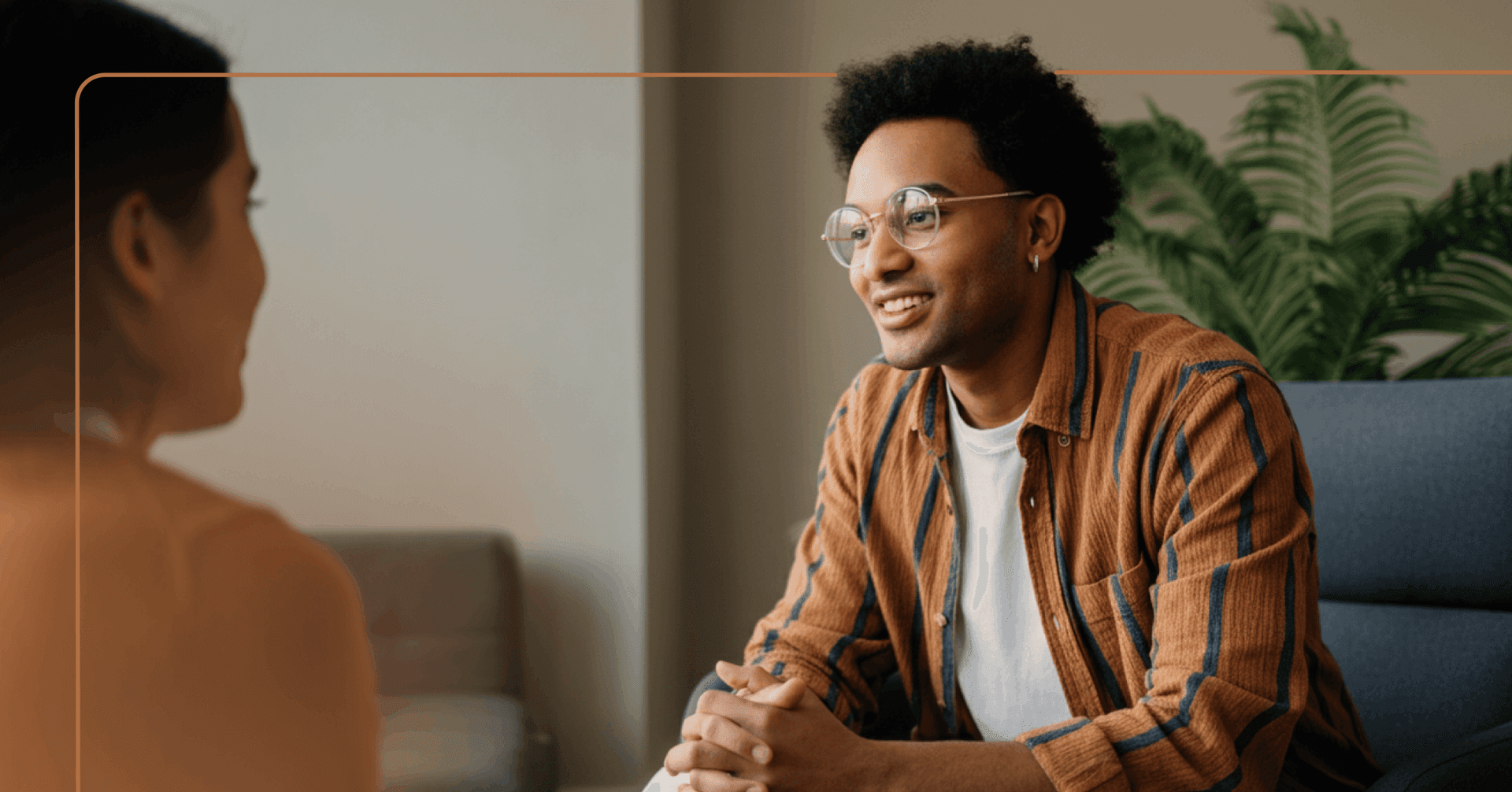 man with history of trauma engages in an in-person therapy session