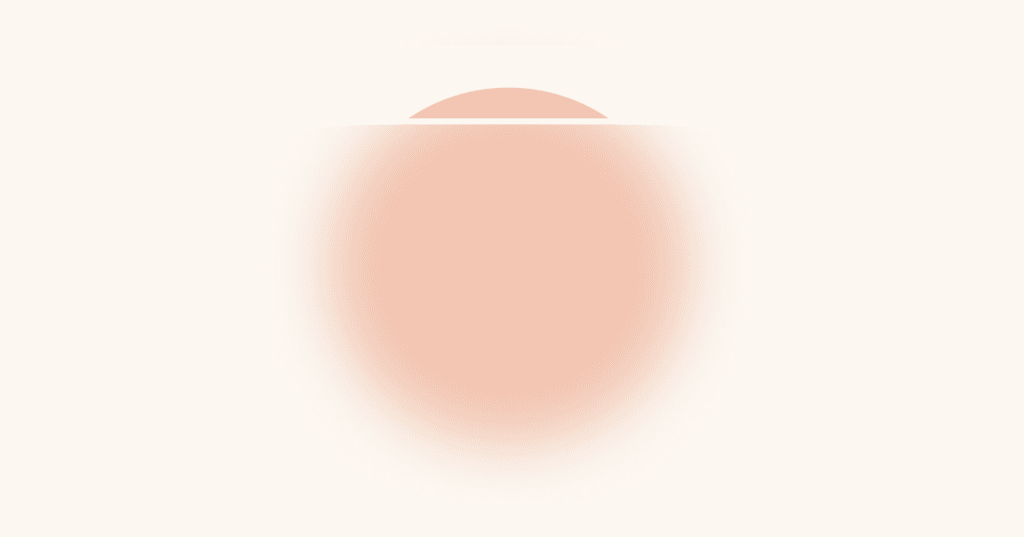 Image shows an orange circle. Almost all the way to the top of the circle is a horizontal white line that goes through the circle. Above the white line, the circle is in sharp focus. Below the white line, the circle is blurry.